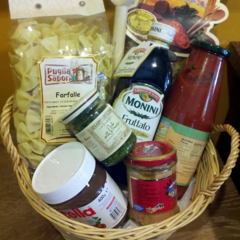 A gift basket from Tino's Delicatessen filled with Italian pasta, sauces, olive oil, and Nutella.