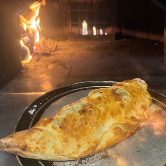 Sausage & Peppers with Mozzarella Calzone.